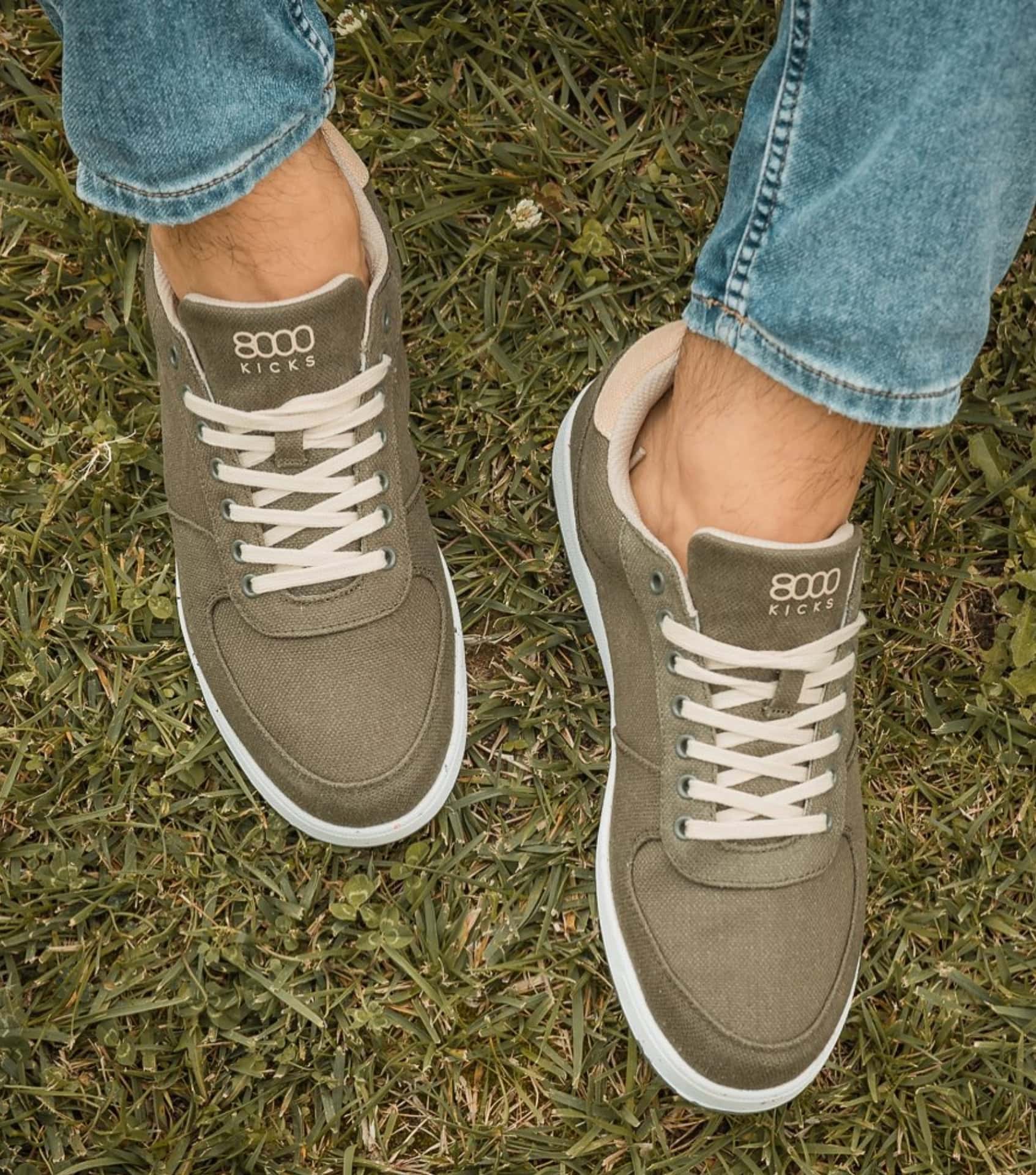 8000Kicks hemp eco friendly sneakers in green with white soles shown outdoors as tested and photographed by Amber from Sustainable Jungle.