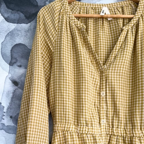 Image by Sustainable Jungle showing testing of Pact's Coastal Double Gauze Poet Sleeve Dress, made from organic cotton. Part of our review exploring how sustainable Pact’s clothing really is, including material quality and eco-friendly production.