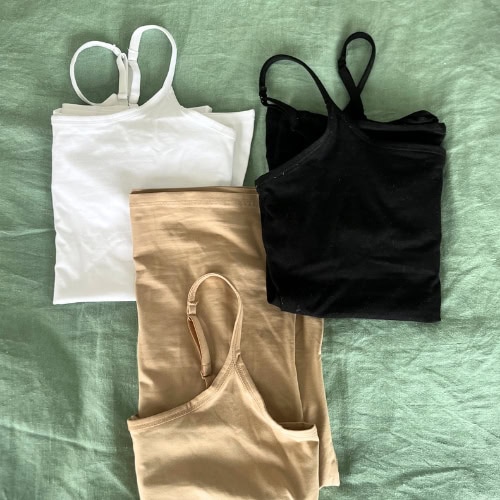 Image by Sustainable Jungle featuring testing of Pact’s Everyday Shelf Bra Camisole collection in black, white, and sand. These soft organic cotton basics were tested as part of our Pact sustainability rating to assess comfort, durability, and ethical manufacturing.